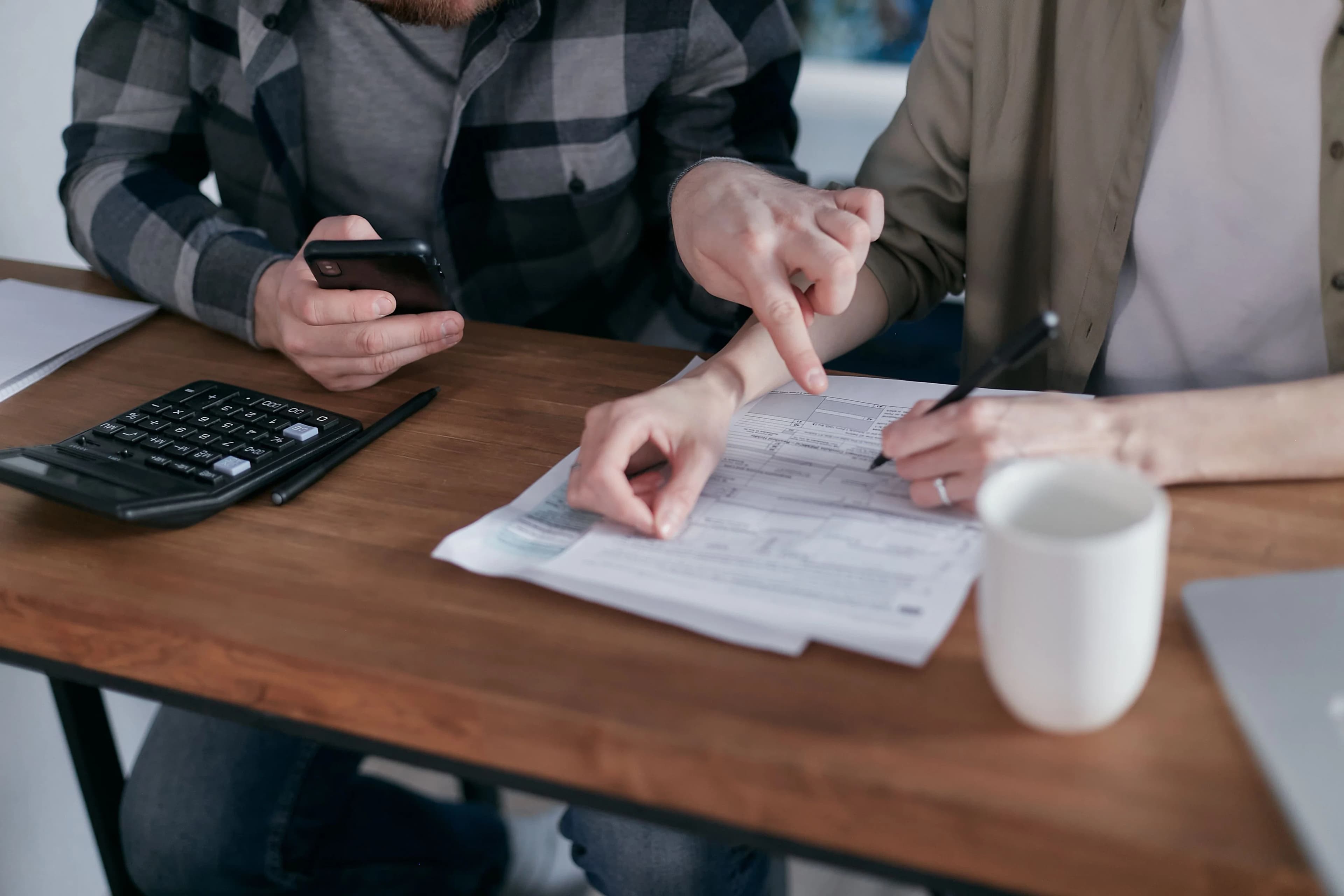 Person helping another person with their debts